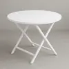 White Round plastic folding table for rent in Punta Cana 