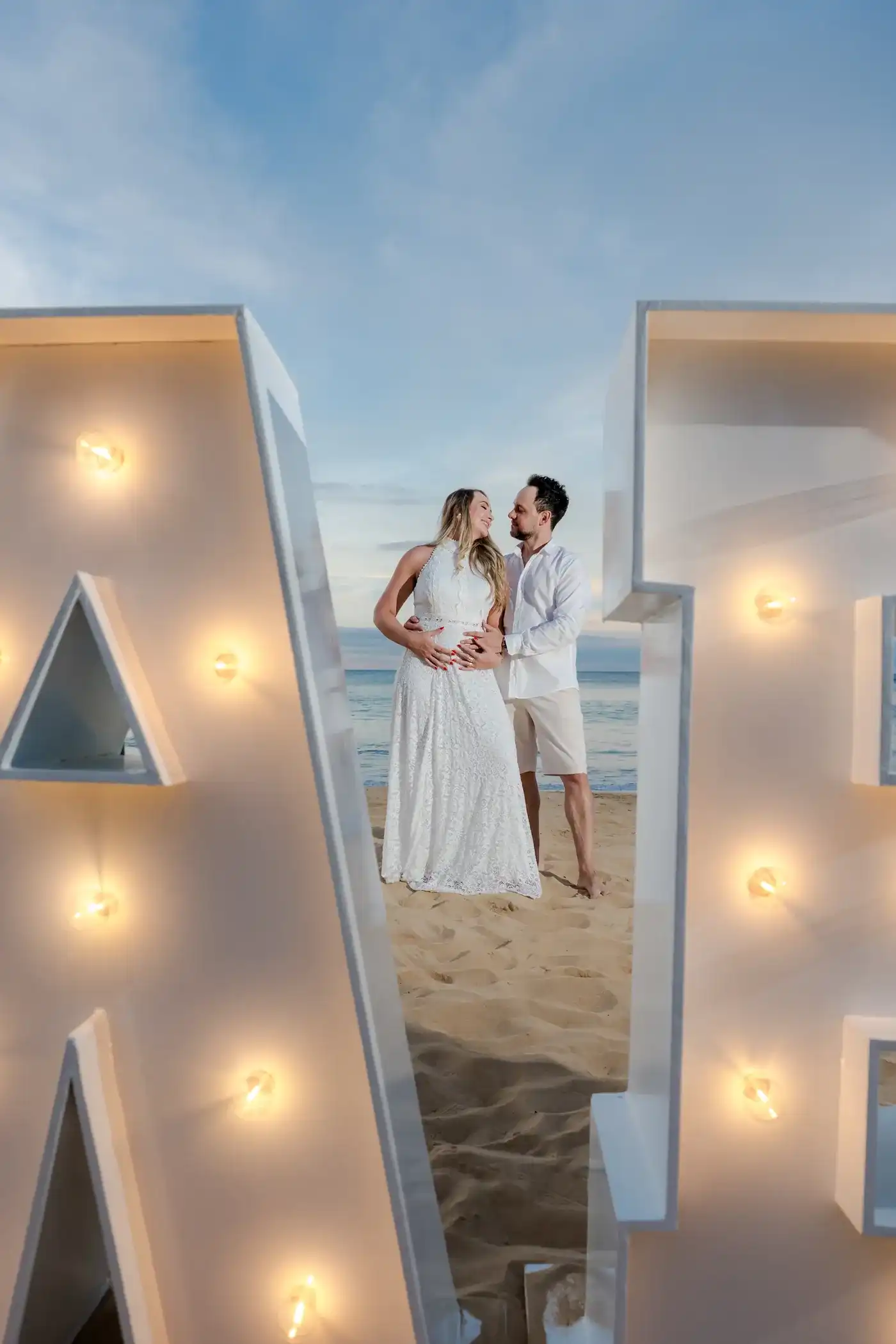 Couple celebrating a gender reveal on the beach in Punta Cana