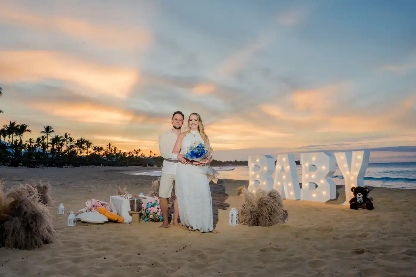 Expecting parents after their Punta Cana gender reveal at sunset